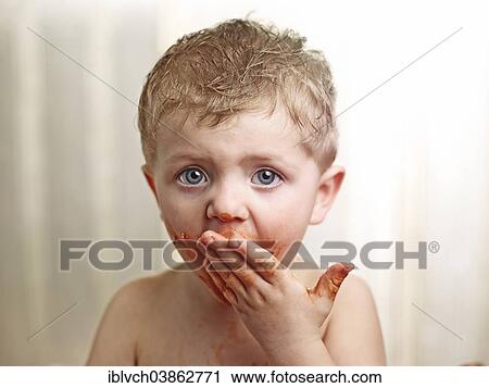 Toddler with a sauce-smeared face View Large Photo Image Stock Image - Toddler with a sauce-smeared face. Fotosearch