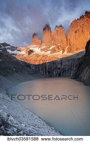 "Torres del Paine massif, mountain lake, at dawn, with first light on the summits of the Torres del Paine mountains, Torres del Paine National Park, Chile, South America" View Large Photo Image Stock Photo - "Torres del Paine massif, mountain lake, at dawn, with first light on the summits of the Torres del Paine mountains, Torres del Paine National Park, Chile, South America". Fotosearch