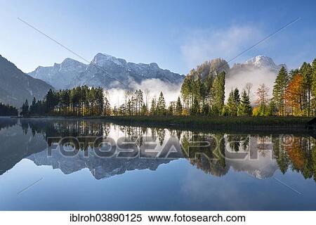 "Totes Gebirge, dead mountains range with reflections in Alpsee Lake, Almtal Valley, Upper Austria, Austria, Europe" View Large Photo Image Stock Photography - "Totes Gebirge, dead mountains range with reflections in Alpsee Lake, Almtal Valley, Upper Austria, Austria, Europe". Fotosearch