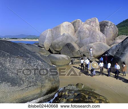 "Tour group at Tianya Haijiao, The End of Heaven and Edge of the Sea, rock formations near Sanya, Hainan Island, China, Asia" View Large Photo Image Stock Photo - "Tour group at Tianya Haijiao, The End of Heaven and Edge of the Sea, rock formations near Sanya, Hainan Island, China, Asia". Fotosearch