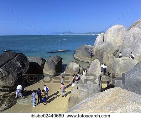 "Tour group at Tianya Haijiao, The End of Heaven and Edge of the Sea, rock formations near Sanya, Hainan Island, China, Asia" View Large Photo Image Stock Photo - "Tour group at Tianya Haijiao, The End of Heaven and Edge of the Sea, rock formations near Sanya, Hainan Island, China, Asia". Fotosearch