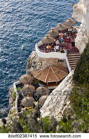 "Tourist attraction, Cova d'en Xoroi, Cala en Porter, South Menorca, Menorca Island, Balearic Islands, Spain, Southern Europe, Europe" View Large Photo Image Stock Photography - "Tourist attraction, Cova d'en Xoroi, Cala en Porter, South Menorca, Menorca Island, Balearic Islands, Spain, Southern Europe, Europe". Fotosearch