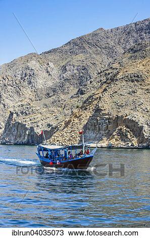 "Tourist boat in form of a dhow, Khor Ash Sham fjord, Musandam, Oman, Asia" View Large Photo Image Stock Image - "Tourist boat in form of a dhow, Khor Ash Sham fjord, Musandam, Oman, Asia". Fotosearch