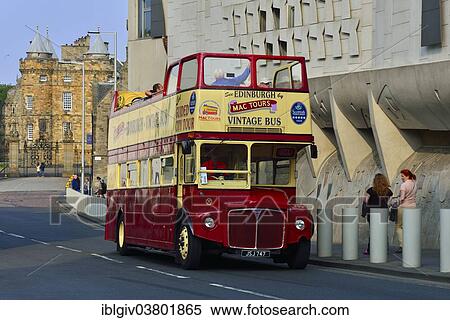 "Tourist bus in front of the modern Scottish Parliament and the Holyrood Palace, Edinburgh, Scotland, United Kingdom, Europe" View Large Photo Image Stock Photography - "Tourist bus in front of the modern Scottish Parliament and the Holyrood Palace, Edinburgh, Scotland, United Kingdom, Europe". Fotosearch