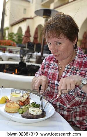 "Tourist eating Surf & Turf, steak and lobster, Huntington Beach, California, United States of America, USA" View Large Photo Image Stock Photo - "Tourist eating Surf & Turf, steak and lobster, Huntington Beach, California, United States of America, USA". Fotosearch