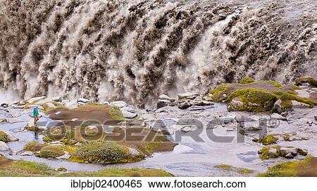 "Tourist in front of Dettifoss waterfall, Iceland, Europe" View Large Photo Image Stock Photography - "Tourist in front of Dettifoss waterfall, Iceland, Europe". Fotosearch