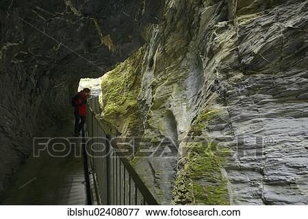 Stock Photo - "Tourist looking down into the Viamala gorge near Thusis, canton of Grisons, Switzerland, Europe". Fotosearch