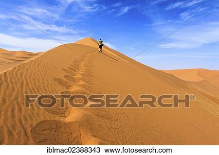 "Tourist on Big Daddy dune, Sosssusvlei, Namib Desert, Namib Naukluft Park, Namibia, Africa" View Large Photo Image Stock Image - "Tourist on Big Daddy dune, Sosssusvlei, Namib Desert, Namib Naukluft Park, Namibia, Africa". Fotosearch