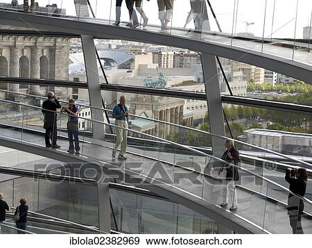 "Tourists and visitors inside the dome of the Reichstag Building with views of the Brandenburg Gate, Berlin, Germany, Europe" View Large Photo Image Stock Photo - "Tourists and visitors inside the dome of the Reichstag Building with views of the Brandenburg Gate, Berlin, Germany, Europe". Fotosearch