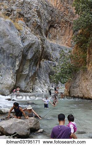 "Tourists crossing the river, Saklikent Canyon, Mugla Province, Lycia, Aegean, Turkey, Asia" View Large Photo Image Stock Image - "Tourists crossing the river, Saklikent Canyon, Mugla Province, Lycia, Aegean, Turkey, Asia". Fotosearch