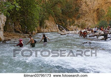 "Tourists crossing the river, Saklikent Canyon, Mugla Province, Lycia, Aegean, Turkey, Asia" View Large Photo Image Stock Image - "Tourists crossing the river, Saklikent Canyon, Mugla Province, Lycia, Aegean, Turkey, Asia". Fotosearch