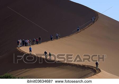 "Tourists during the ascent of the """"Big Daddy"""" or """"Crazy Dune"""" sand dune, Namib, Hardap Region, Namibia, Africa" View Large Photo Image Stock Photo - "Tourists during the ascent of the """"Big Daddy"""" or """"Crazy Dune"""" sand dune, Namib, Hardap Region, Namibia, Africa". Fotosearch