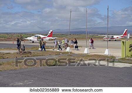"Tourists getting of a plane of AeroGal airlines at Baltra airport island, Galapagos, Ecuador, South America" View Large Photo Image Stock Photo - "Tourists getting of a plane of AeroGal airlines at Baltra airport island, Galapagos, Ecuador, South America". Fotosearch