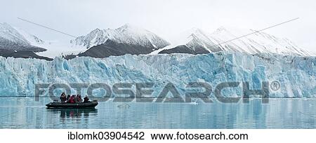 "Tourists in a rubber dinghy in front of the rim of the Monacobreen Glacier, Liefdefjorden, Spitsbergen, Svalbard Islands, Svalbard and Jan Mayen, Norway, Europe" View Large Photo Image Stock Image - "Tourists in a rubber dinghy in front of the rim of the Monacobreen Glacier, Liefdefjorden, Spitsbergen, Svalbard Islands, Svalbard and Jan Mayen, Norway, Europe". Fotosearch