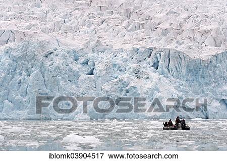 "Tourists in a rubber dinghy in front of the rim of the Monacobreen Glacier, Liefdefjorden, Spitsbergen, Svalbard Islands, Svalbard and Jan Mayen, Norway, Europe" View Large Photo Image Stock Photo - "Tourists in a rubber dinghy in front of the rim of the Monacobreen Glacier, Liefdefjorden, Spitsbergen, Svalbard Islands, Svalbard and Jan Mayen, Norway, Europe". Fotosearch