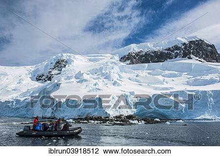 "Tourists in a zodiac in front of glaciers and icebergs, Mikkelsen Islands, Antarctica" View Large Photo Image Stock Image - "Tourists in a zodiac in front of glaciers and icebergs, Mikkelsen Islands, Antarctica". Fotosearch