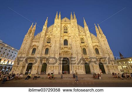 Stock Photo - "Tourists in front of the west facade of Milan Cathedral or Duomo di Santa Maria Nascente, in the evening light, Milan, Lombardy, Italy, Europe". Fotosearch