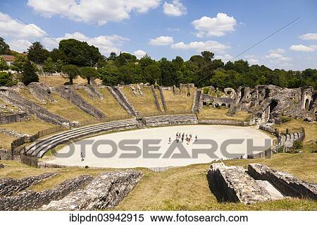 Stock Photography - "Tourists in the arena of the Roman amphitheatre, Saintes, Departement Charente-Maritime, France, Europe". Fotosearch