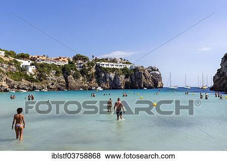 "Tourists in the shallow sea, Cala en Porter, Minorca, Balearic Islands, Spain, Europe" View Large Photo Image Stock Photo - "Tourists in the shallow sea, Cala en Porter, Minorca, Balearic Islands, Spain, Europe". Fotosearch