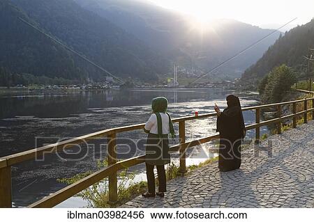"Tourists lake looking at lake Uzungol, village of Uzungol, Trabzon Province, Pontic Mountains, Black Sea Region, Turkey, Asia" View Large Photo Image Stock Photograph - "Tourists lake looking at lake Uzungol, village of Uzungol, Trabzon Province, Pontic Mountains, Black Sea Region, Turkey, Asia". Fotosearch
