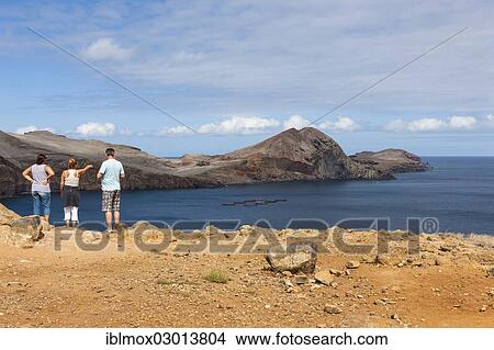 "Tourists looking towards the cliffs of the volcanic peninsula of Ponta de Sao Lourenco, nature reserve, Funchal, Canical, Ilha da Madeira, Portugal, Europe" View Large Photo Image Picture - "Tourists looking towards the cliffs of the volcanic peninsula of Ponta de Sao Lourenco, nature reserve, Funchal, Canical, Ilha da Madeira, Portugal, Europe". Fotosearch