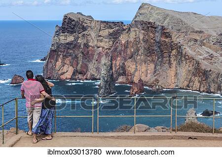 "Tourists looking towards the cliffs of the volcanic peninsula of Ponta de Sao Lourenco, nature reserve, Funchal, Canical, Ilha da Madeira, Portugal, Europe" View Large Photo Image Stock Image - "Tourists looking towards the cliffs of the volcanic peninsula of Ponta de Sao Lourenco, nature reserve, Funchal, Canical, Ilha da Madeira, Portugal, Europe". Fotosearch
