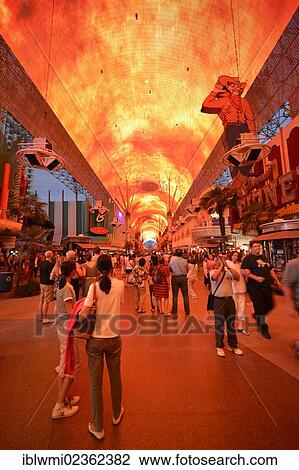 Stock Image - "Tourists marvel at a laser show in the neon dome of the Fremont Street Experience in old Las Vegas, Downtown Las Vegas, Nevada, United States of America, USA, PublicGround". Fotosearch