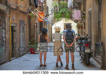 "Tourists marvel at an alley in the Gothic Quarter of Barcelona, ​​Catalonia, Spain, Europe" View Large Photo Image Stock Photo - "Tourists marvel at an alley in the Gothic Quarter of Barcelona, ​​Catalonia, Spain, Europe". Fotosearch