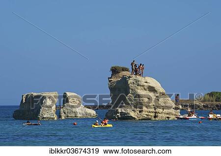 "Tourists on a rock formation, near Noto, Ragusa Province, Sicily, Italy, Europe" View Large Photo Image Stock Photo - "Tourists on a rock formation, near Noto, Ragusa Province, Sicily, Italy, Europe". Fotosearch