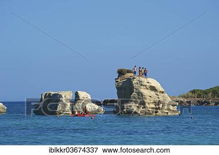 "Tourists on a rock formation, near Noto, Ragusa Province, Sicily, Italy, Europe" View Large Photo Image Stock Photo - "Tourists on a rock formation, near Noto, Ragusa Province, Sicily, Italy, Europe". Fotosearch