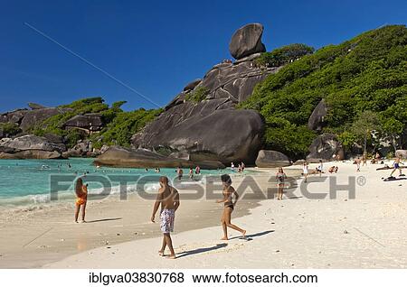 "Tourists on Ao Kueak Beach, Sail Rock at the back, Mu Ko Similan National Park, Thailand, Asia" View Large Photo Image Stock Photo - "Tourists on Ao Kueak Beach, Sail Rock at the back, Mu Ko Similan National Park, Thailand, Asia". Fotosearch