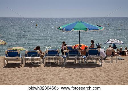 "Tourists on the beach, Blanes, La Selva, Costa Brava, Catalonia, Spain, Europe, PublicGround, Europe" View Large Photo Image Stock Photography - "Tourists on the beach, Blanes, La Selva, Costa Brava, Catalonia, Spain, Europe, PublicGround, Europe". Fotosearch