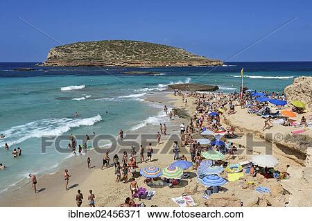 "Tourists on the beach, Cala Comte, Platges de Comte, Ibiza, Pitiusic Islands or Pine Islands, Balearic Islands, Spain, Europe" View Large Photo Image Stock Image - "Tourists on the beach, Cala Comte, Platges de Comte, Ibiza, Pitiusic Islands or Pine Islands, Balearic Islands, Spain, Europe". Fotosearch