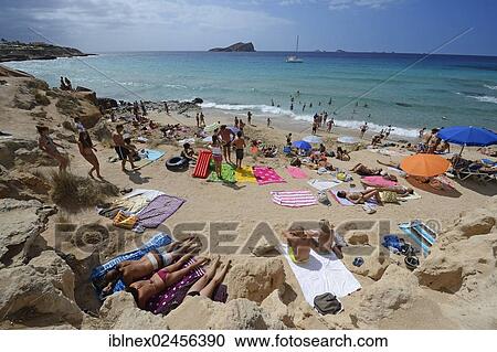 "Tourists on the beach, Cala Comte, Platges de Comte, Ibiza, Pitiusic Islands or Pine Islands, Balearic Islands, Spain, Europe" View Large Photo Image Stock Image - "Tourists on the beach, Cala Comte, Platges de Comte, Ibiza, Pitiusic Islands or Pine Islands, Balearic Islands, Spain, Europe". Fotosearch