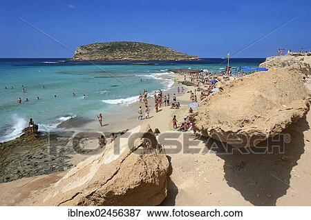 "Tourists on the beach, Cala Comte, Platges de Comte, Ibiza, Pitiusic Islands or Pine Islands, Balearic Islands, Spain, Europe" View Large Photo Image Stock Photo - "Tourists on the beach, Cala Comte, Platges de Comte, Ibiza, Pitiusic Islands or Pine Islands, Balearic Islands, Spain, Europe". Fotosearch