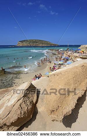 "Tourists on the beach, Cala Comte, Platges de Comte, Ibiza, Pitiusic Islands or Pine Islands, Balearic Islands, Spain, Europe" View Large Photo Image Stock Photograph - "Tourists on the beach, Cala Comte, Platges de Comte, Ibiza, Pitiusic Islands or Pine Islands, Balearic Islands, Spain, Europe". Fotosearch