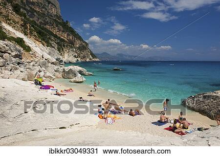 "Tourists on the beach, Cala Goloritze, Golfo di Orosei, Parco Nazionale del Gennargentu e Golfo di Goloritze, Sardinia, Italy, Europe" View Large Photo Image Stock Image - "Tourists on the beach, Cala Goloritze, Golfo di Orosei, Parco Nazionale del Gennargentu e Golfo di Goloritze, Sardinia, Italy, Europe". Fotosearch