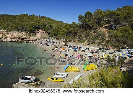 "Tourists on the beach, Cala Salada, Ibiza, Pitiusic Islands or Pine Islands, Balearic Islands, Spain, Europe" View Large Photo Image Stock Photo - "Tourists on the beach, Cala Salada, Ibiza, Pitiusic Islands or Pine Islands, Balearic Islands, Spain, Europe". Fotosearch