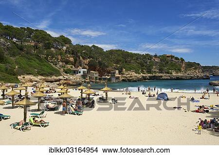"Tourists on the beach in the bay at Cala Llombards, Cala Llombards, Santanyi, Majorca, Balearic Islands, Spain, Europe" View Large Photo Image Picture - "Tourists on the beach in the bay at Cala Llombards, Cala Llombards, Santanyi, Majorca, Balearic Islands, Spain, Europe". Fotosearch