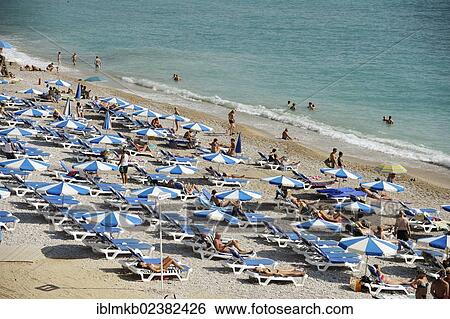 "Tourists on the beach of Albir, Costa Blanca, Spain, Europe" View Large Photo Image Stock Photograph - "Tourists on the beach of Albir, Costa Blanca, Spain, Europe". Fotosearch