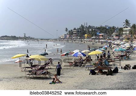 Stock Image - "Tourists on the beach of Kovalam, Malabar Coast, Malabar, Kerala, South India, India, Asia". Fotosearch