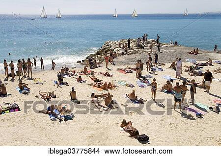 "Tourists on the beach on Promenade des Anglais, Nice, Provence-Alpes-Cote d’Azur, France, Europe" View Large Photo Image Picture - "Tourists on the beach on Promenade des Anglais, Nice, Provence-Alpes-Cote d’Azur, France, Europe". Fotosearch