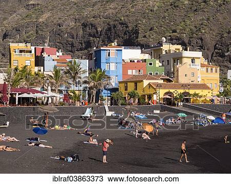 "Tourists on the black beach of Puerto de Tazacorte, La Palma, Canary Islands, Spain, Europe" View Large Photo Image Stock Image - "Tourists on the black beach of Puerto de Tazacorte, La Palma, Canary Islands, Spain, Europe". Fotosearch