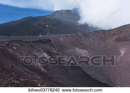 "Tourists on the La Montagnola crater, lava fields behind, south side, Mount Etna in Zafferana, Sicily, Italy, Europe" View Large Photo Image Stock Image - "Tourists on the La Montagnola crater, lava fields behind, south side, Mount Etna in Zafferana, Sicily, Italy, Europe". Fotosearch