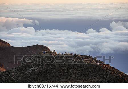 "Tourists on the summit of the Haleakala volcano at sunrise, Haleakala National Park, Maui, Hawaii, USA" View Large Photo Image Picture - "Tourists on the summit of the Haleakala volcano at sunrise, Haleakala National Park, Maui, Hawaii, USA". Fotosearch
