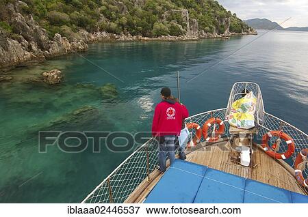 "Tourists on yacht looking at the ruins of the sunken city of Kekova, Turkey, Asia" View Large Photo Image Stock Photo - "Tourists on yacht looking at the ruins of the sunken city of Kekova, Turkey, Asia". Fotosearch