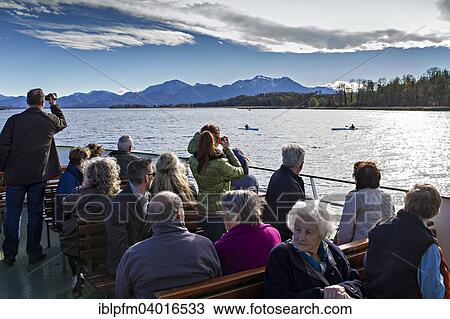 "Tourists sightseeing on a Chiemsee ferry, Upper Bavaria, Bavaria, Germany, Europe" View Large Photo Image Stock Image - "Tourists sightseeing on a Chiemsee ferry, Upper Bavaria, Bavaria, Germany, Europe". Fotosearch