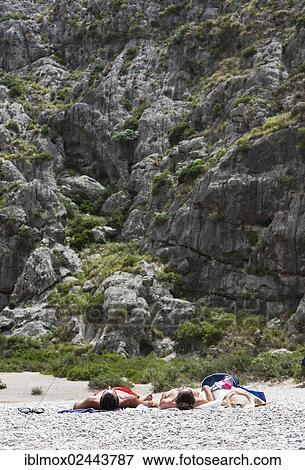 "Tourists sunbathing in Torrent de Pareis Gorge, Cala de Sa Calobra Bay, Sa Calobra, Tramuntana Mountains, Majorca, Balearic Islands, Spain, Europe" View Large Photo Image Stock Photo - "Tourists sunbathing in Torrent de Pareis Gorge, Cala de Sa Calobra Bay, Sa Calobra, Tramuntana Mountains, Majorca, Balearic Islands, Spain, Europe". Fotosearch