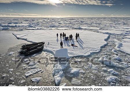 "Tourists taken in inflatable boats onto an ice floe, pack ice, Arctic Ocean, Spitsbergen Island, Svalbard Archipelago, Svalbard and Jan Mayen, Norway, Europe" View Large Photo Image Stock Photograph - "Tourists taken in inflatable boats onto an ice floe, pack ice, Arctic Ocean, Spitsbergen Island, Svalbard Archipelago, Svalbard and Jan Mayen, Norway, Europe". Fotosearch