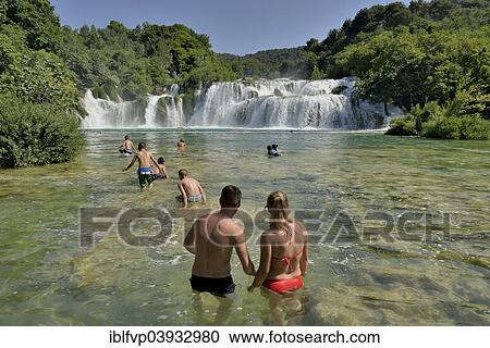 "Tourists taking a bath at the Skradinski buk waterfalls, Krka National Park, Sibenik-Knin County, Dalmatia, Croatia, Europe" View Large Photo Image Stock Image - "Tourists taking a bath at the Skradinski buk waterfalls, Krka National Park, Sibenik-Knin County, Dalmatia, Croatia, Europe". Fotosearch